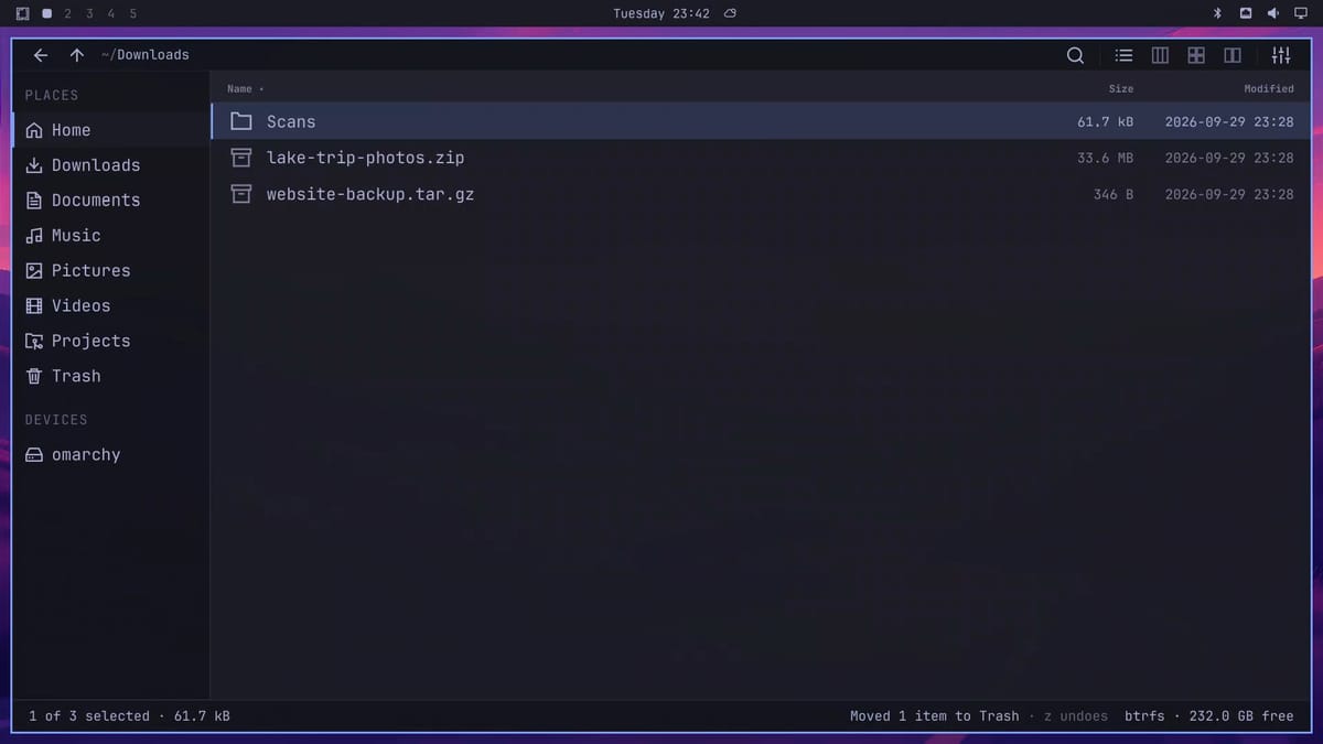 Flea's Downloads folder after the extracted folder went to the Trash, with the status bar reading Moved 1 item to Trash, z undoes