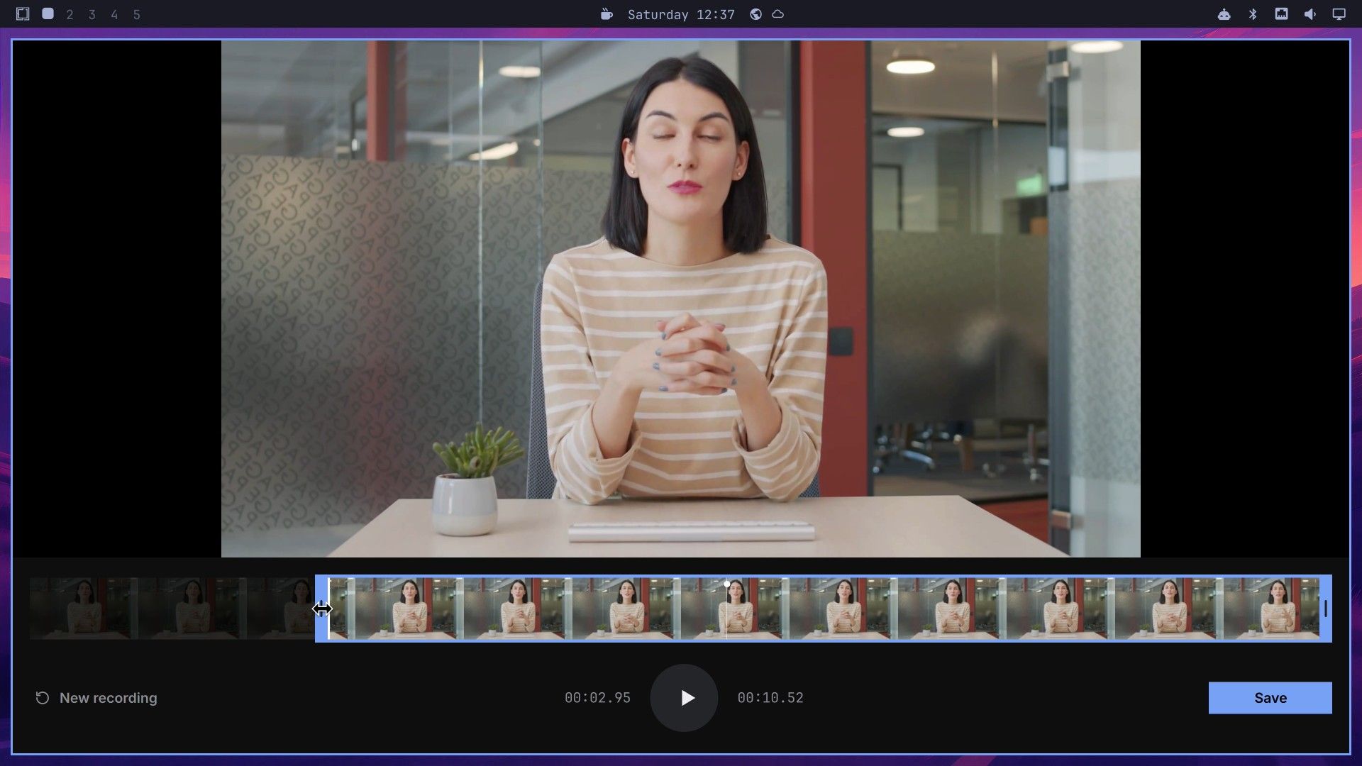 The Monologue editor with a sample clip of a woman at a desk, a filmstrip trimmed by about three seconds at the start, and the Save button