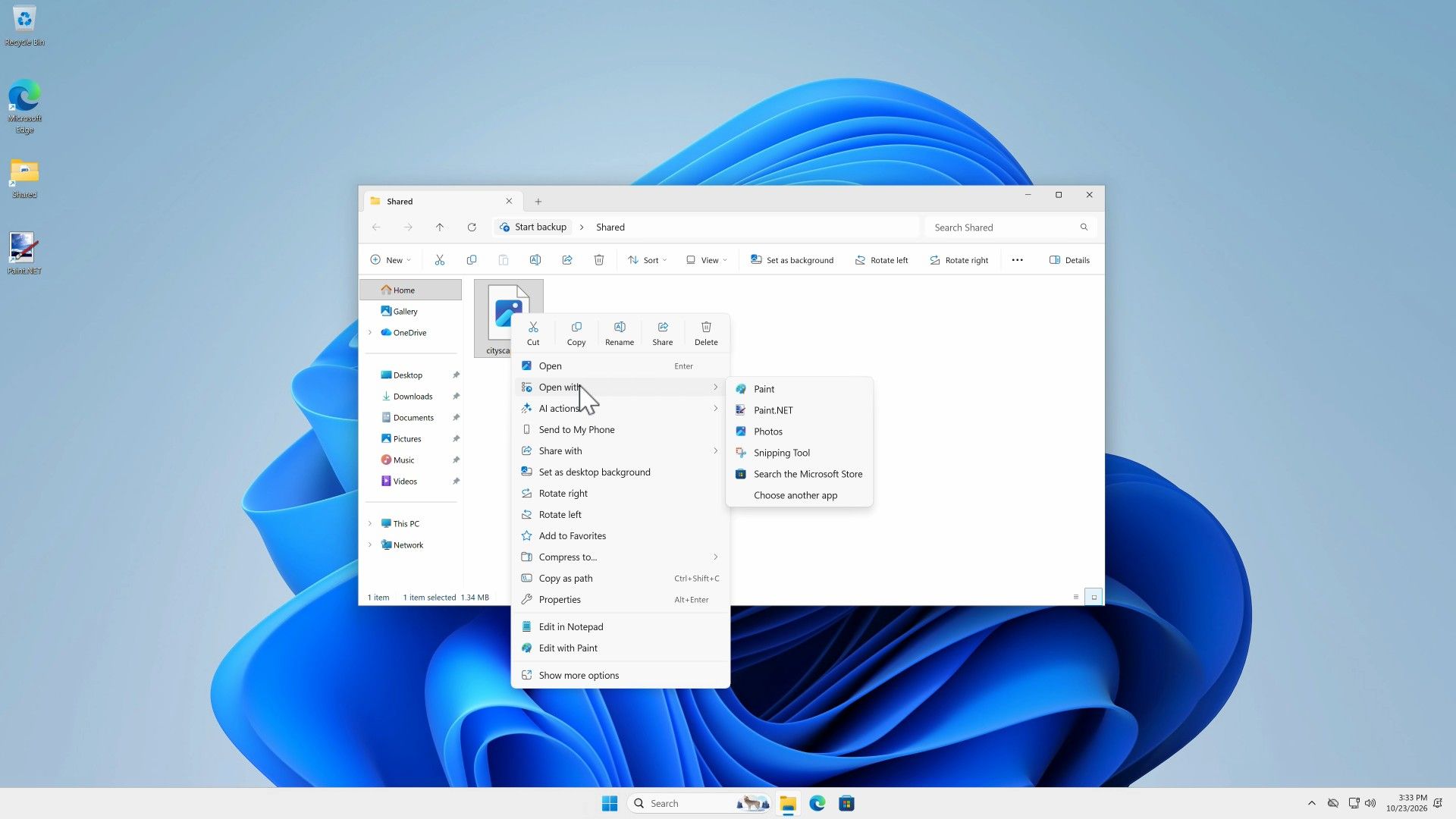 File Explorer in the Shared folder with the right-click menu on cityscape.jpg, Open with expanded to list Paint, Paint.NET, Photos, Snipping Tool, Search the Microsoft Store, and Choose another app