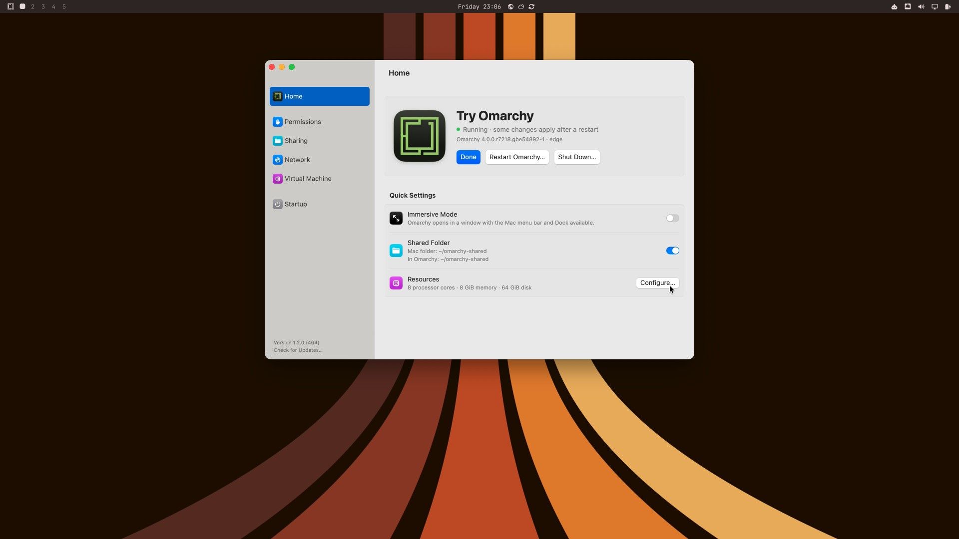 The Try Omarchy settings window open over the Ristretto wallpaper, with the status Running, some changes apply after a restart, Immersive Mode turned off, and Shared Folder set to Mac folder ~/omarchy-shared and In Omarchy ~/omarchy-shared